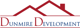 DunmireDevelopmentLogo Company logo of dunmire development featuring stylized mountain peaks above the lettering.